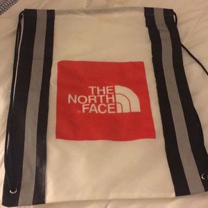 North Face Cinch Backpack with reflective strips